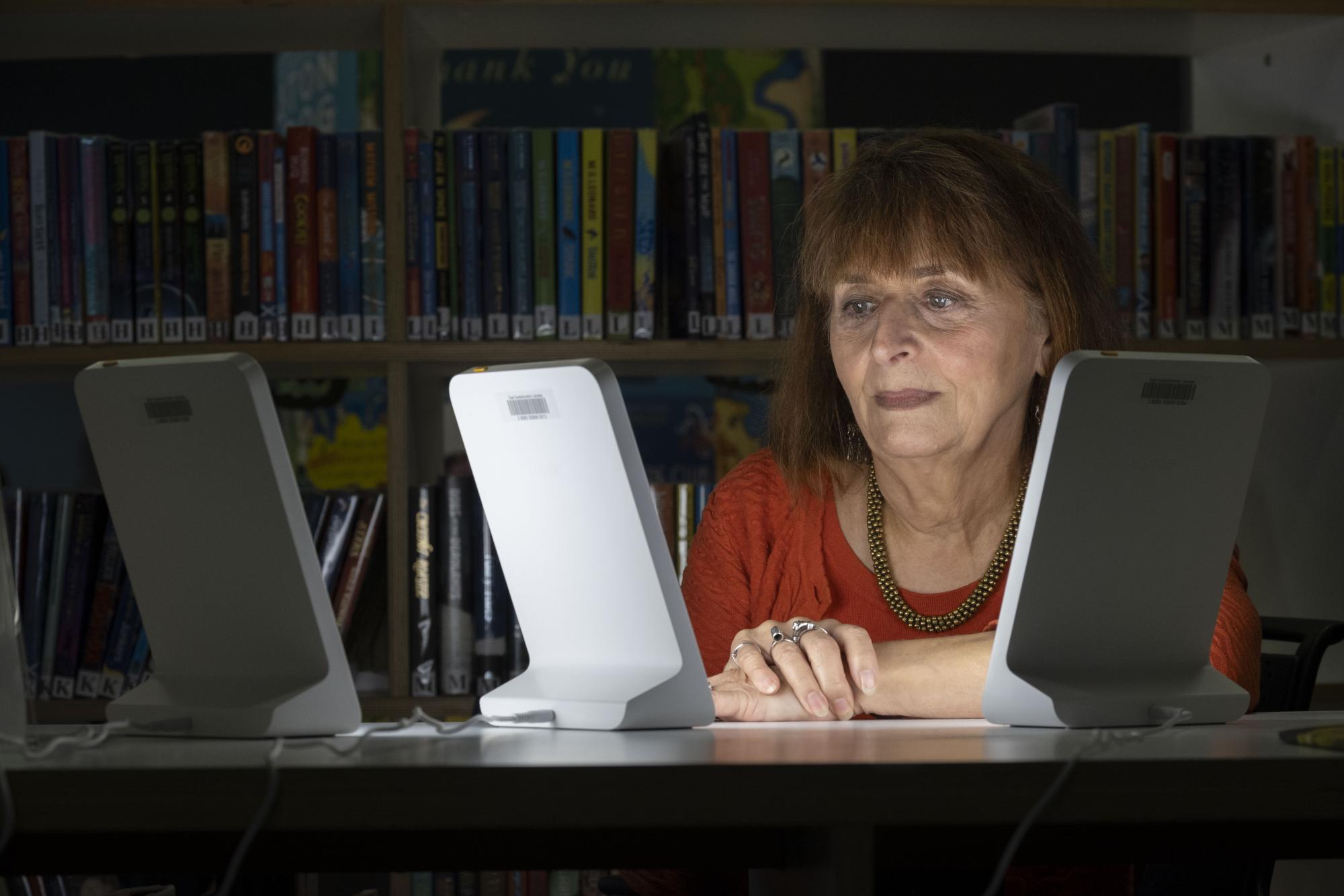 Claire Charlwood is pictured using one of the SAD lamps at the William Patrick Library in Kirkintilloch.