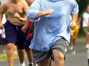 Participants run up a hill during morning exercise